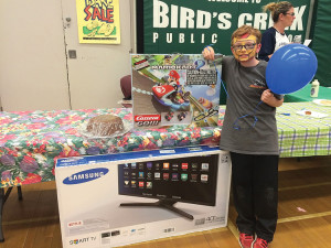 Jakson Parker (aka Iron Man) cleans up, winning the Grand Prize 40" LED Smart TV generously donated by Bancroft Auto Body.